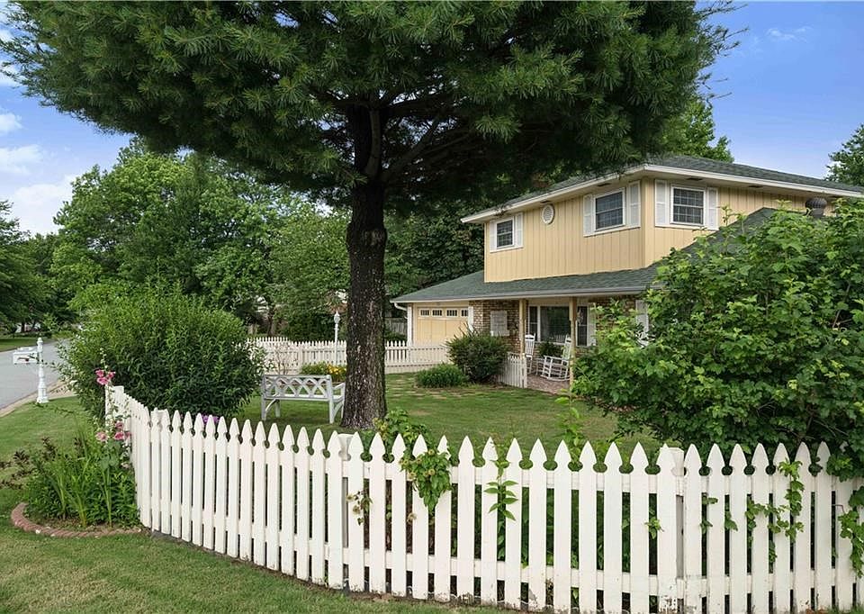This charming front setting has  unmatched curb appeal.  Get lost in time rocking on your front porch.