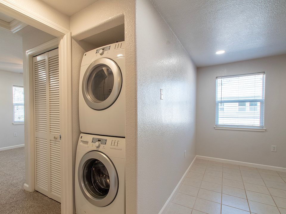 Stackable washer/dryer, entrance to north bedroom, partial kitchen