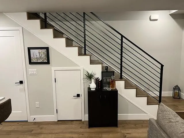 Stairs going up to the second level, pantry and under stair storage.