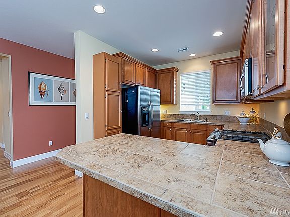 Open Kitchen with Wrap-Around Eating Bar