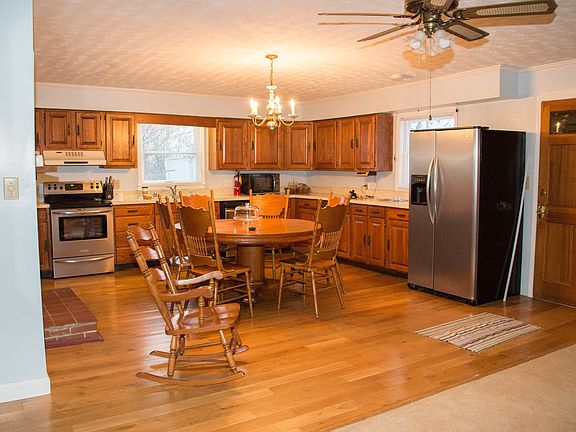Large country kitchen with small TV sitting area.