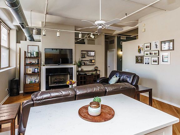 Kitchen opens into well appointed living space cen