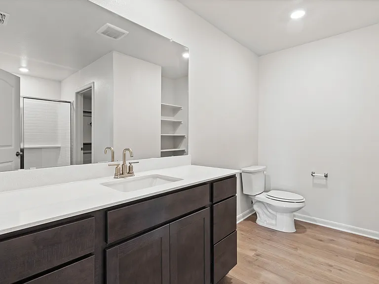 The master bathrooms have large vanity spaces.