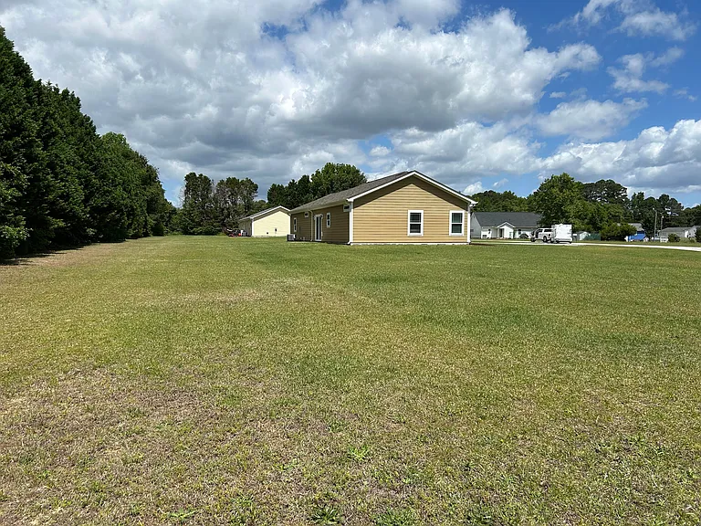 Back,...note SIZE of LOT....1.1 ACRES