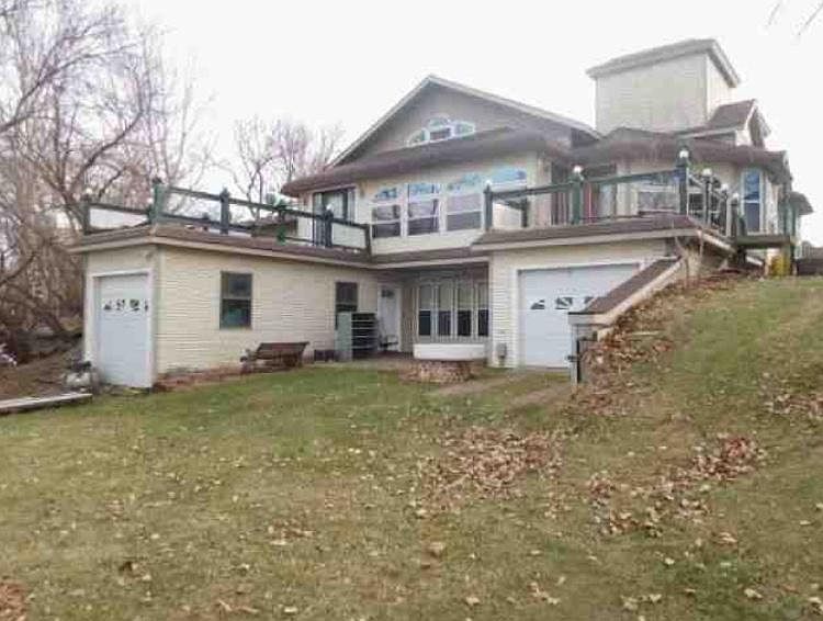 Back of Home, this unit is the bottom level walk out. Inclu