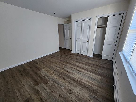 Upstairs bedroom with his and her closets