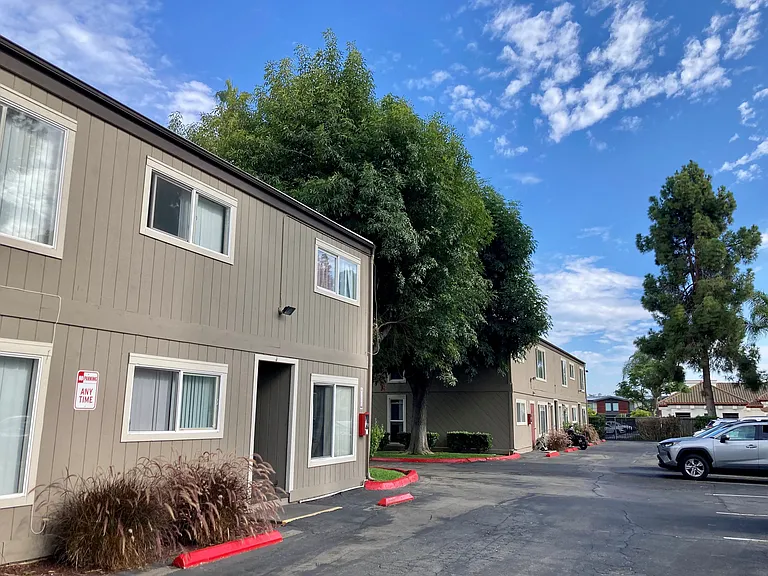 Parking lot and back of Solana Park's two apartment buildings in Solana Beach, California.
