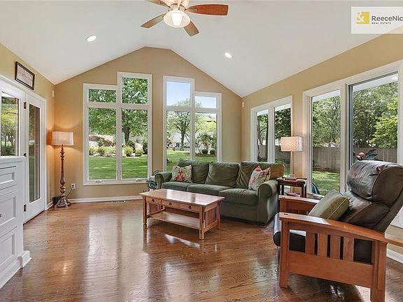 Morning sun surrounds you in this east facing sun room, which opens onto the deck, patio and gorgeous landscaped yard.