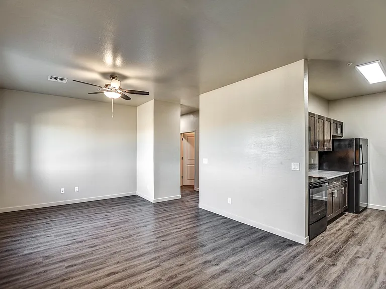 Front door view of kitchen and living room