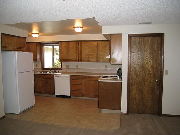Kitchen and family room before new floors.