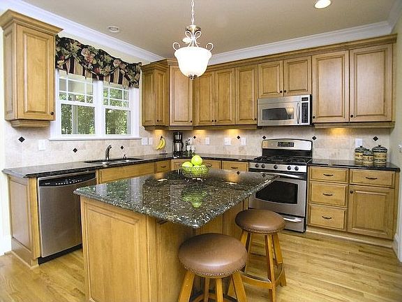 KITCHEN WITH GRANITE AND SS APPLIANCES