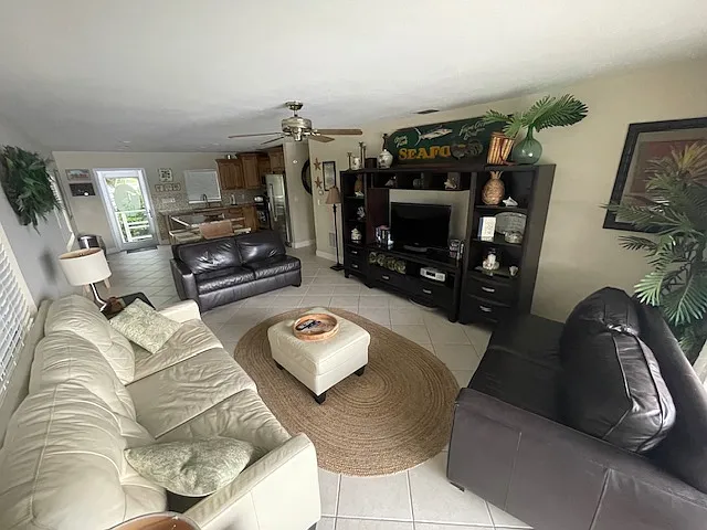 3 couches in the open concept living area for relaxing and spending time with family and friends.