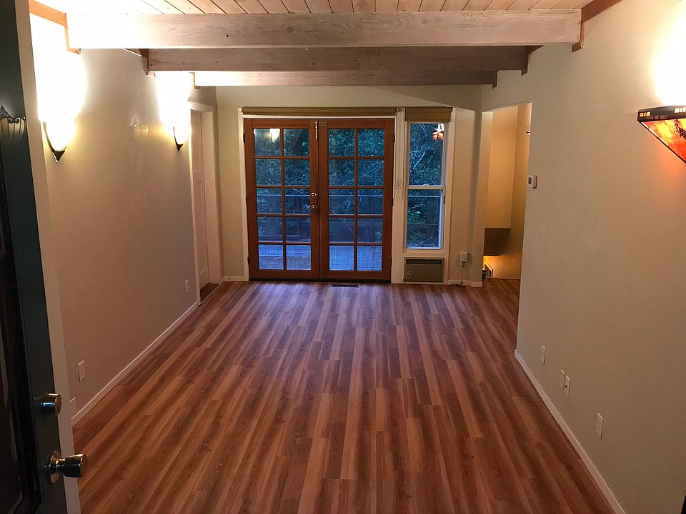 Standing at entrance looking to living room and deck.
