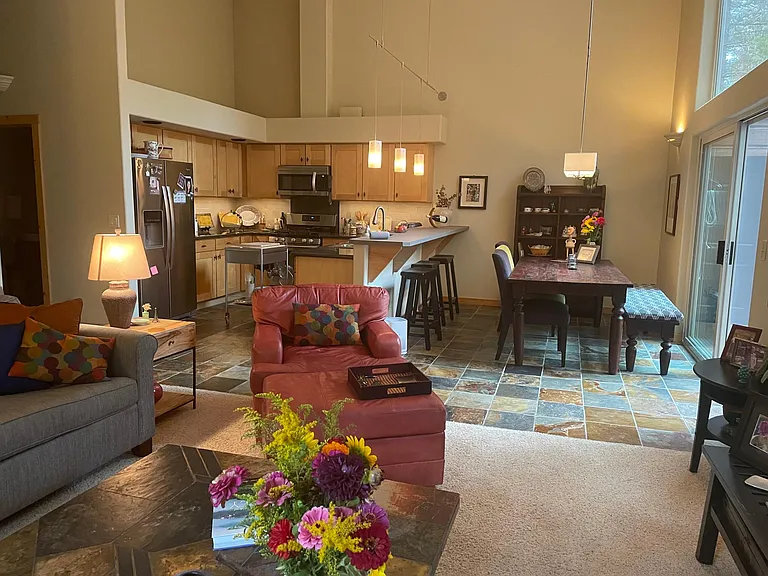 Open concept living with a big family table. All stainless steel appliances and gourmet cookware.