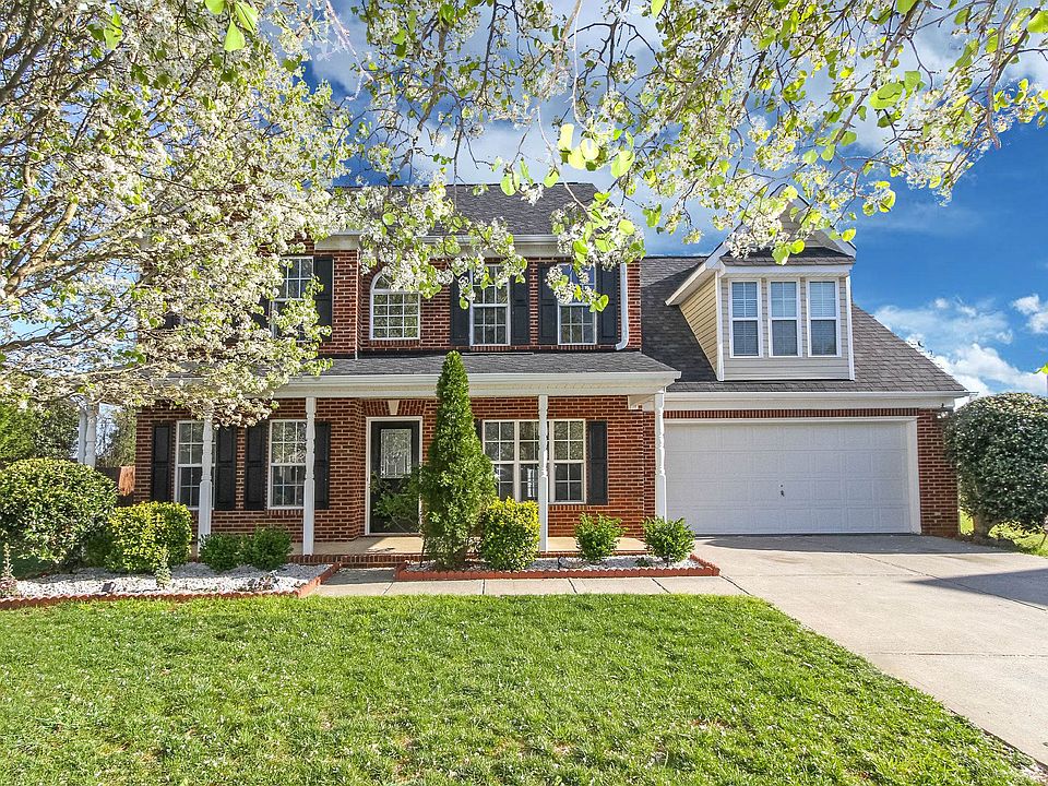 Wide front porch on brick-front home