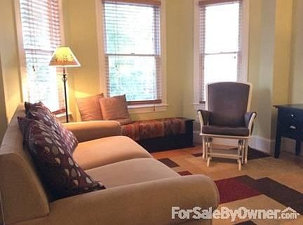 Living and Dining Rooms
						:
						Sunny living room with large bay windows. Dining room is adjacent to LR.