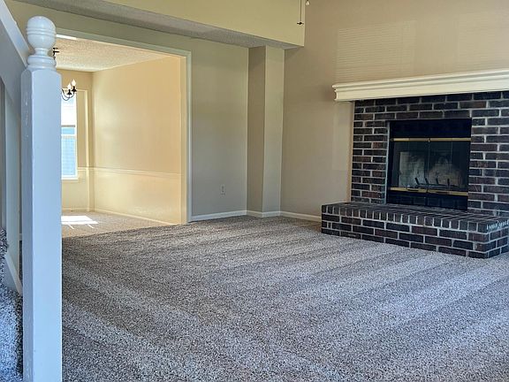 Living Room from Front Door, Vaulted Ceiling, Gas FP, stairs to 2nd floor