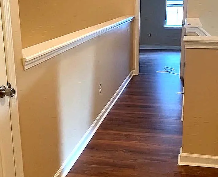 Upstairs hall view to bedroom on right