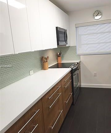 Kitchen completely remodeled with Corian counter tops, soft close drawers, pantry with pull out drawers, all stainless steel app