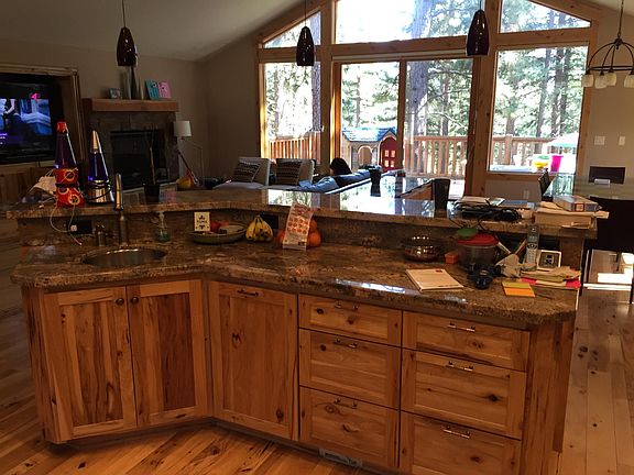 Island which also has sink. Looks out to living room, dining area and deck. Third floor