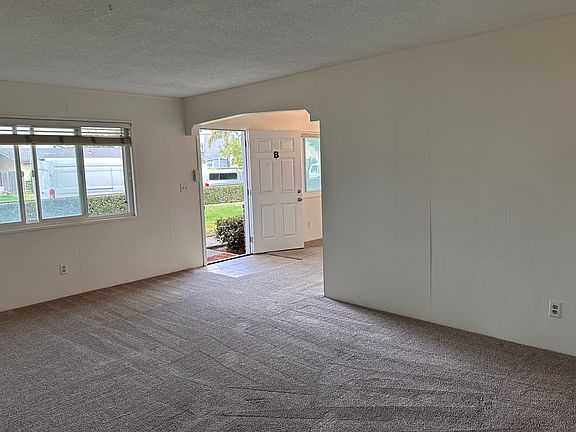 Living room to front door.