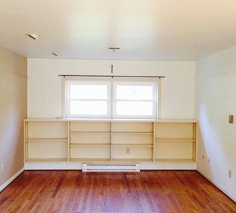 in-built bookcase met with gorgeous hardwood floors