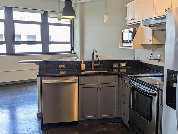 Kitchen with window view and stainless steel appliances