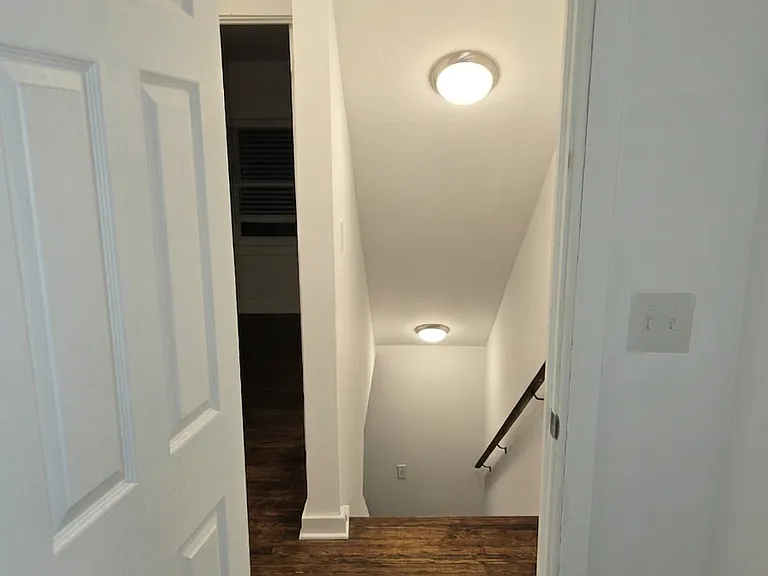 Stairs leading up to 2 bedrooms and 1 full bath