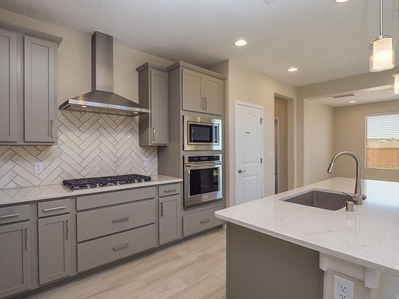 Kitchen features upgraded cabinets and countertops.