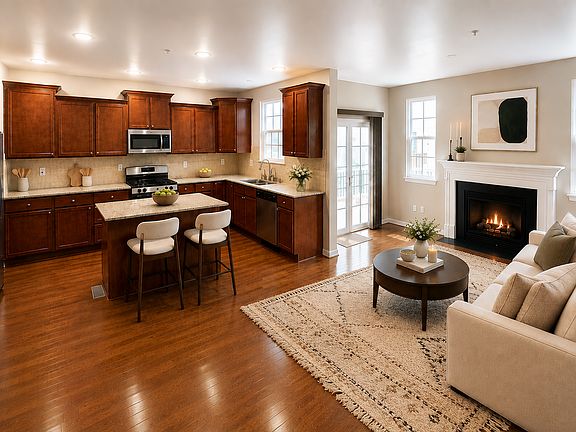 The kitchen flows effortlessly from the living room to the deck outdoors. This the place for lingering conversations, shared meals, and everyday moments that quietly become the ones you remember for years. (Photos are virtually staged)