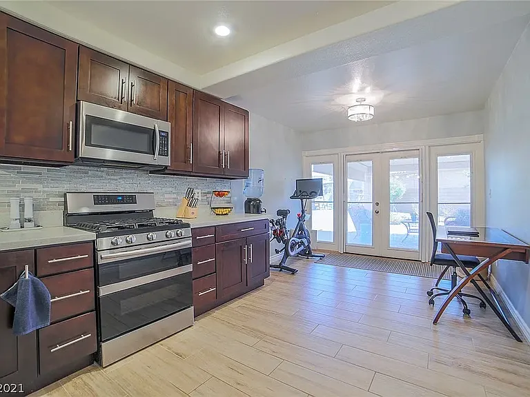 Kitchen looking towards backyard, pet door.