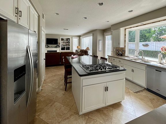 Tons of natural light, counter space, and storage in this entertainers kitchen