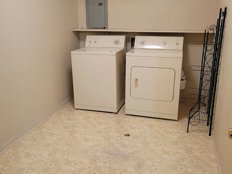 Utility room washer and dryer furnished