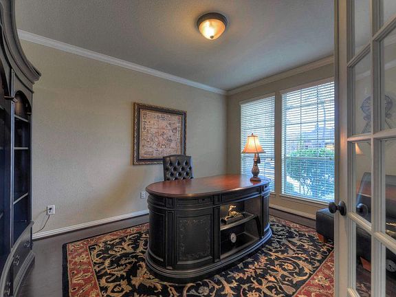 This nice sized study features wood floors and crown molding.