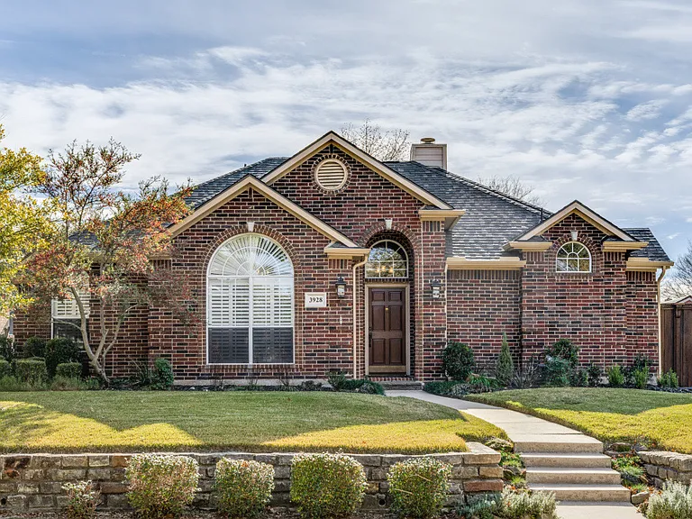 Another view of the front of the house. Well maintained landscape.