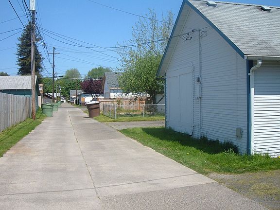 Back of back house in paved alley