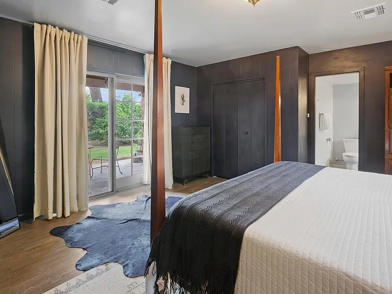 Master bedroom has direct access to the back patio