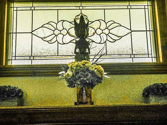 Stained glass over fireplace