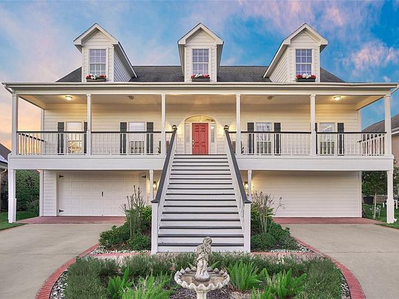 Spacious driveway which provides additional parking leads up to the over-sized 2 car garage (deep enough for 4 vehicles)