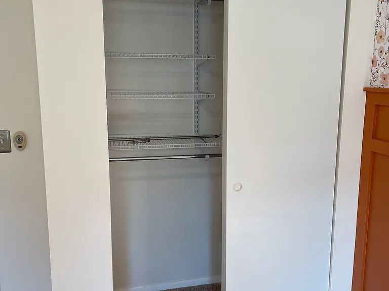 Bedroom full size closet with customizable closet system