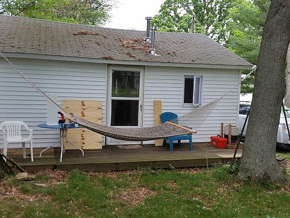 back of cottage with deck