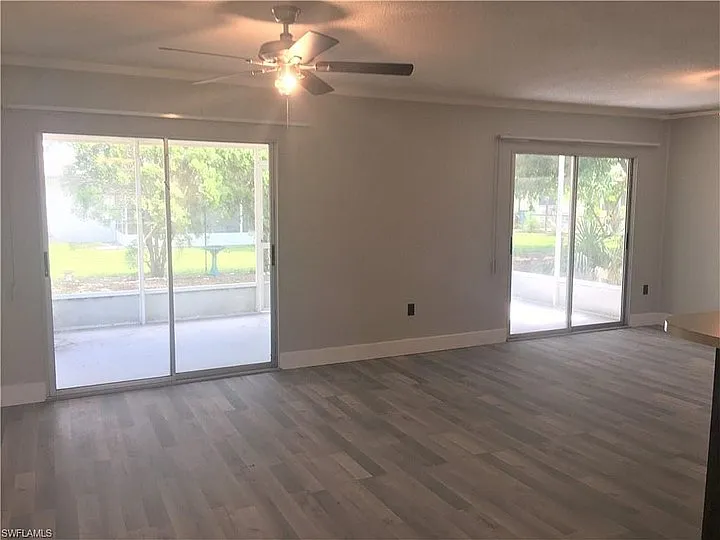 The family room has two sliding doors to the screened back porch
