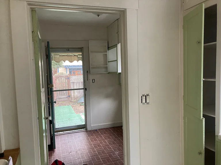 View to laundry or pantry room from kitchen.