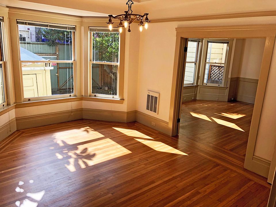Bright sunny afternoon light flood the bedroom and living rooms.