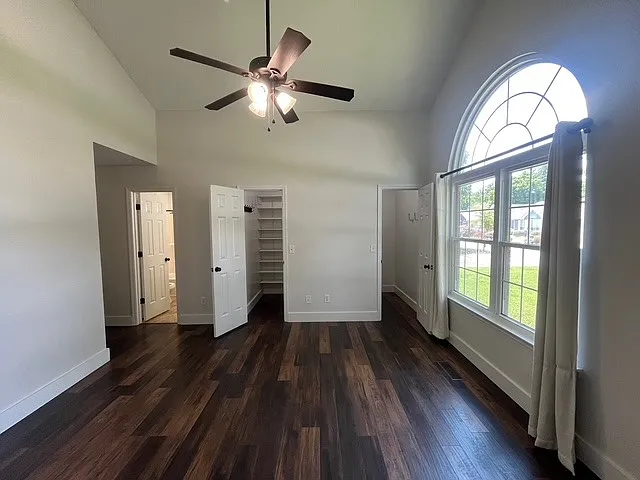 Master Bedroom with his/her walk in closets and vaulted ceiling.