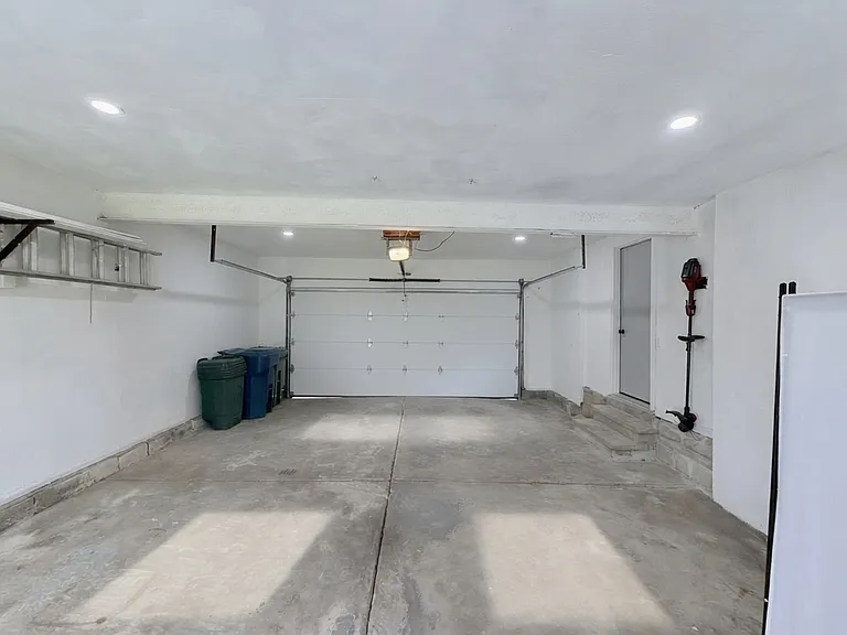 Spacious 2-car attached garage with extra storage space