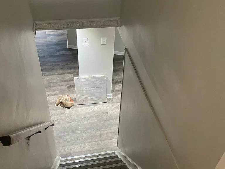 Stairs leading to the large finished basement.