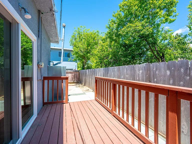 Deck off kitchen entering backyard