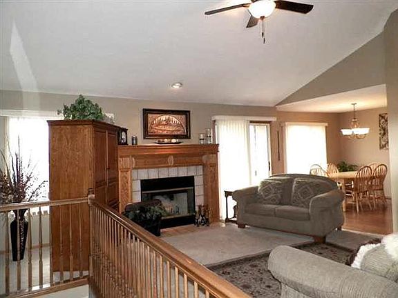 Open floor plan with wood burning fireplace