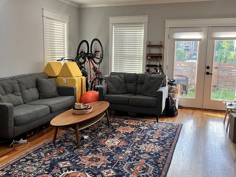 Back room on first floor. Doors lead to backyard.
